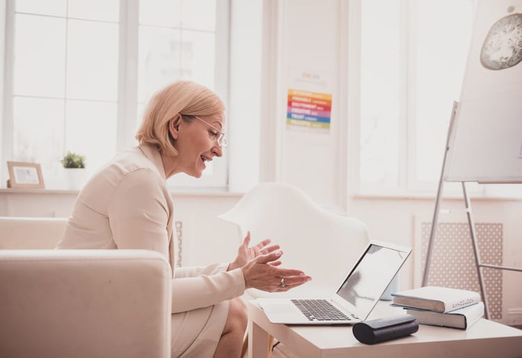 Therapist speaking to a patient over video call.