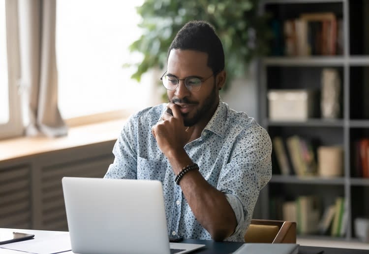 Man using laptop at desk