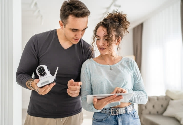 Couple choosing the best home security system.