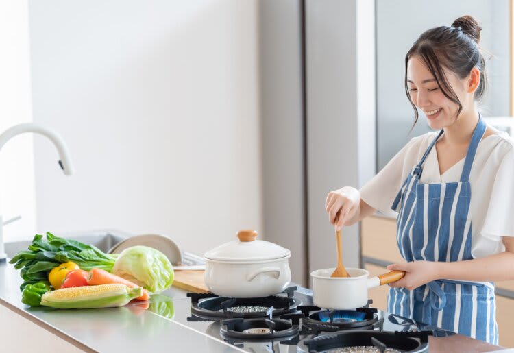 a woman making a gluten-free meal from HelloFresh