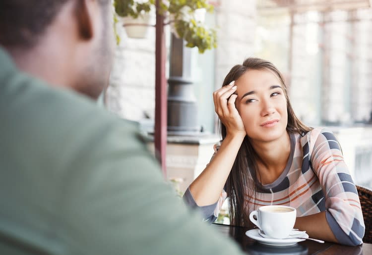 Upset woman in a situationship on a coffee date with a man