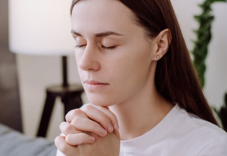 Woman praying.