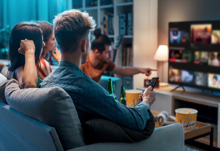 A group of friends debating best Sling TV alternatives.