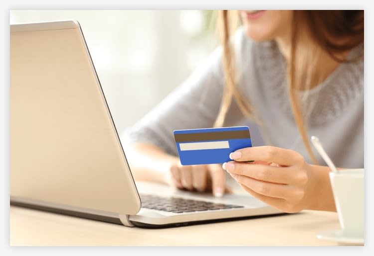 Photo of woman shopping on laptop