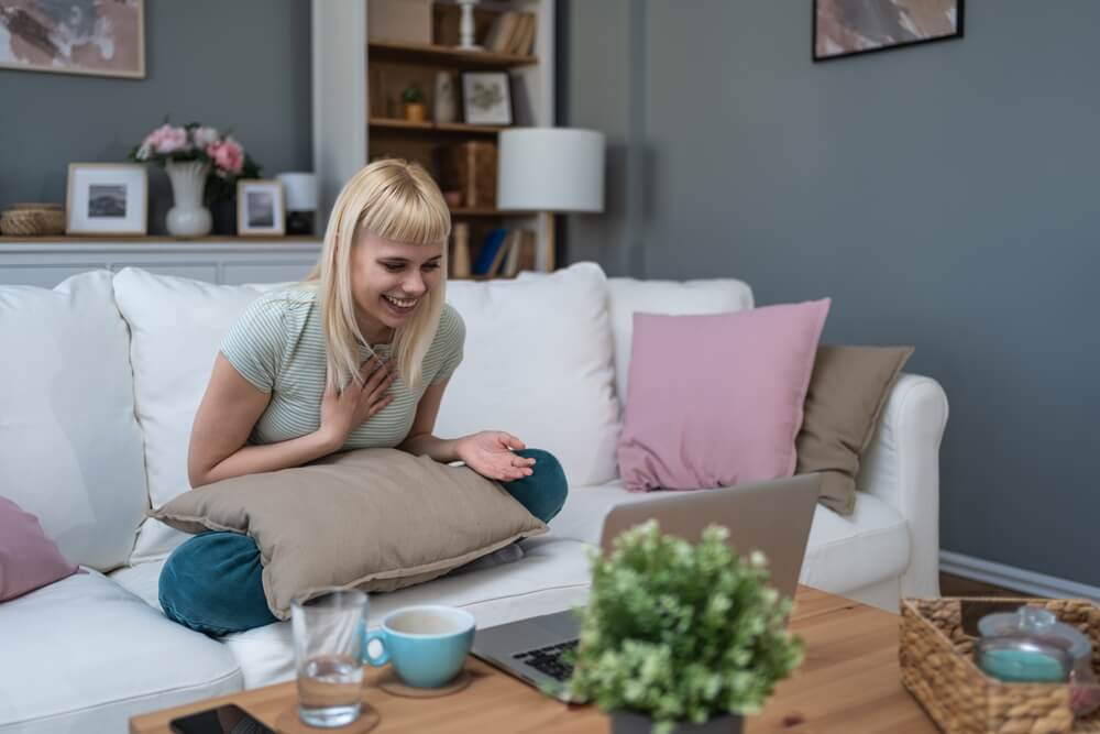 a laptop computer sitting on top of a wooden desk