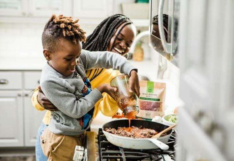 Mother and son cooking together