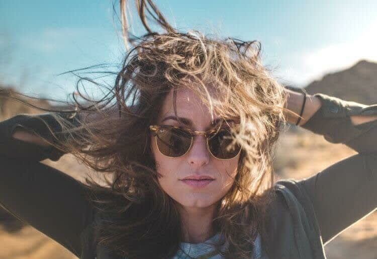 Confident woman wearing sunglasses