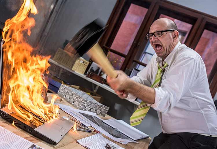 angry man breaking computer angry man breaking computer