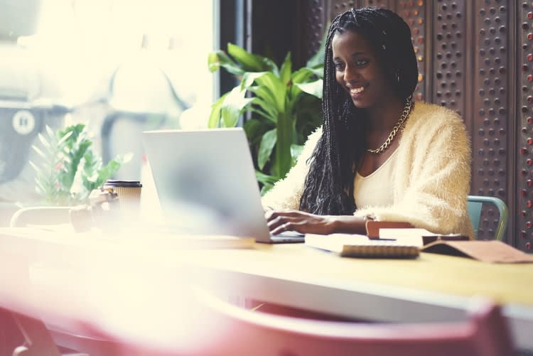 Happy lady making a website Happy lady making a website