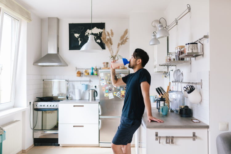 a man drinking protein shake