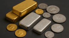 a pile of silver and gold coins and a gold bar