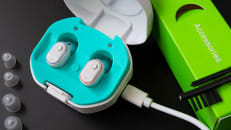 A rechargeable hearing aid in its charging case