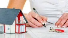Man signing a home warranty plan