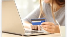 Photo of woman shopping on laptop