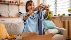 A woman feeling happy and safe while online shopping 