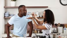 Couple, cooking and kitchen with food taste and eating at home with love, care and feeding. 