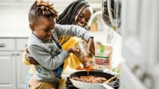 Mother and son cooking together