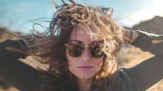 Confident woman wearing sunglasses