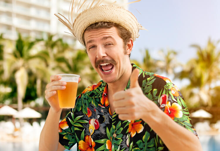 A young man drinking a beer is growing a mustache in support of Movember