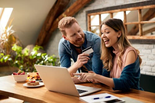 Man and woman shopping online