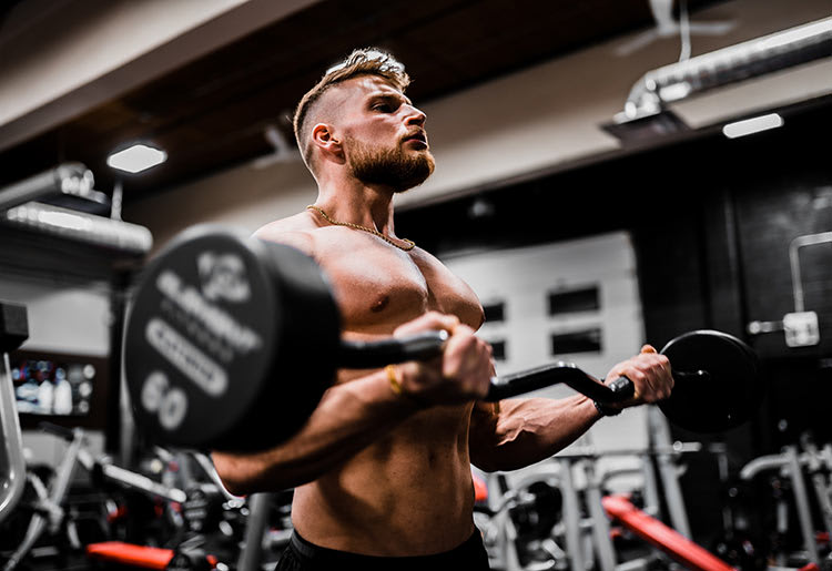 A young man trains in the weight room