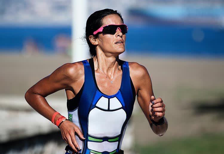 A female long distance runner during a race.